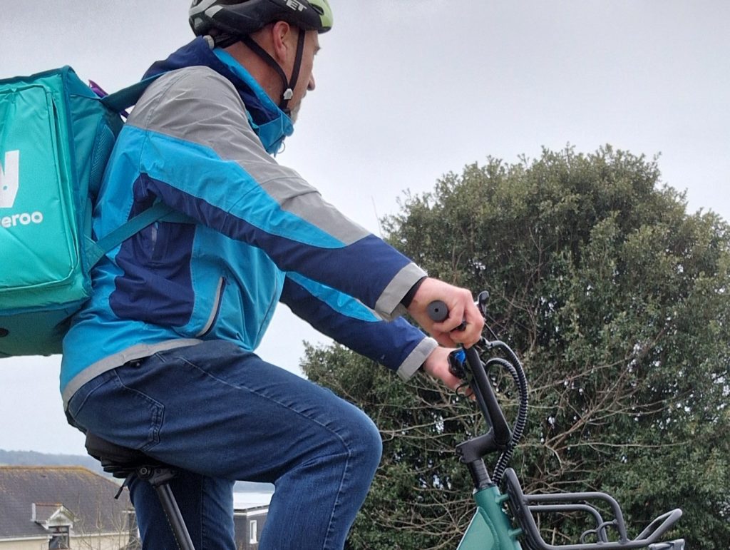 a photo of the article author riding an e-bike for stuart delivery