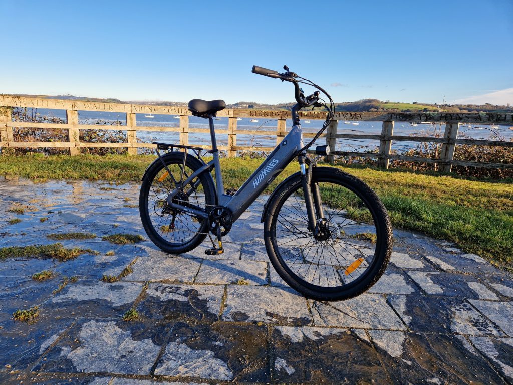 hillmiles milecity 1 e-bike pictured by an estuary on a cloudless sunny day